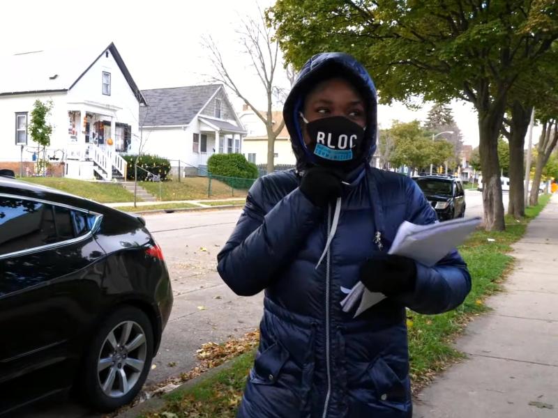 A deep canvassing volunteer holding a clipboard