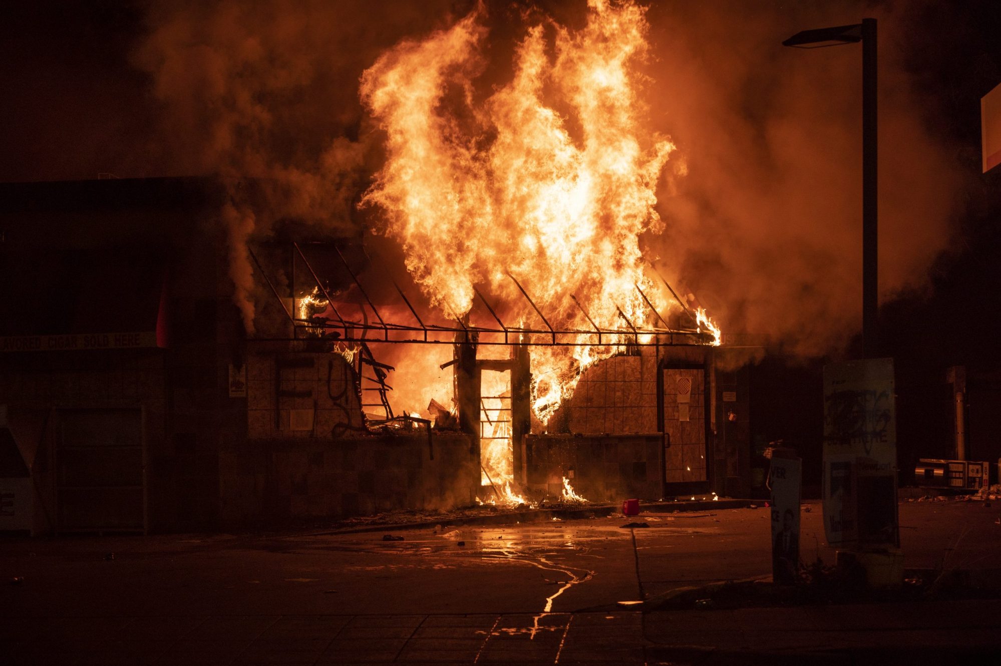 A fire burns at a gas station on Lake Street on May 29, 2020 in Minneapolis, Minnesota. Protests have been ongoing in the state and around the country since George Floyd's death while in police custody on Monday. Photo by Stephen Maturen/Getty Images