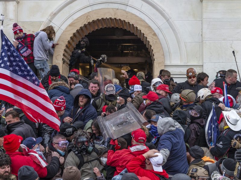 Police use tear gas around the US Capitol building as pro-Trump supporters riot and storm the building on Jan 6, 2021.