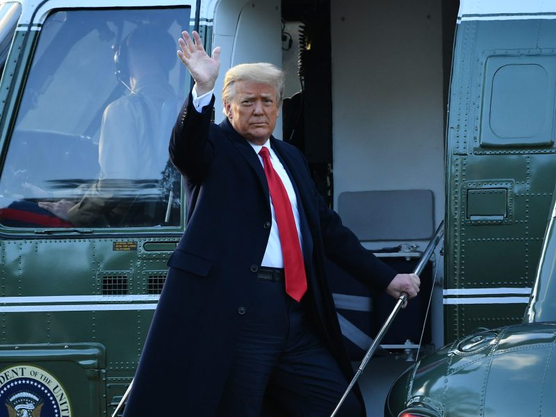 Outgoing US President Donald Trump waves as he boards Marine One at the White House