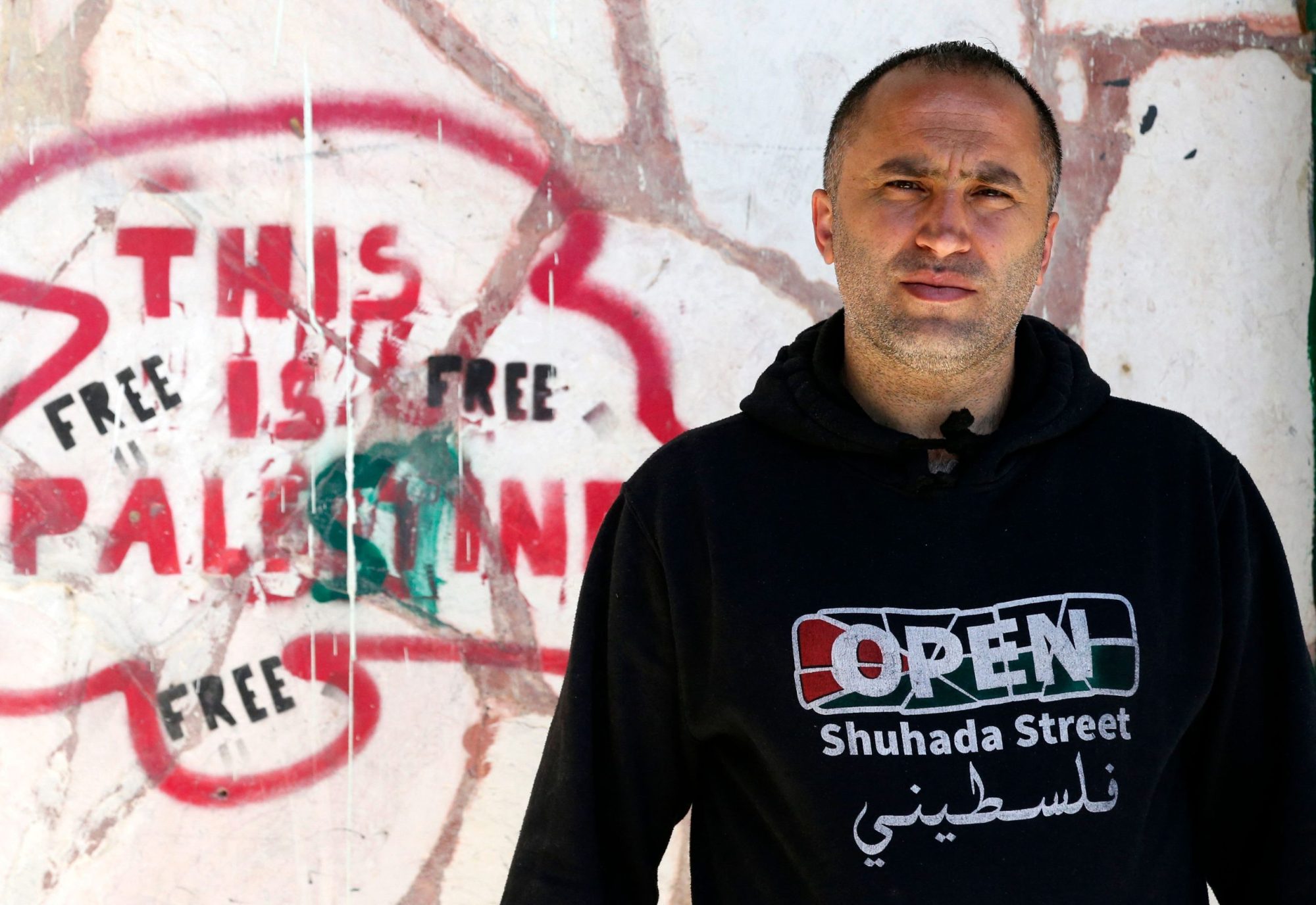 Palestinian Issa Amro speaks is pictured in front the headquarters of Youth Against Settlements (YAS)organisation, that he is a member of, in the occupied West Bank City of Hebron, about his meeting with US Secretary of State Antony Blinken during his recent visit, on May 28, 2021. Photo by HAZEM BADER/AFP via Getty Images