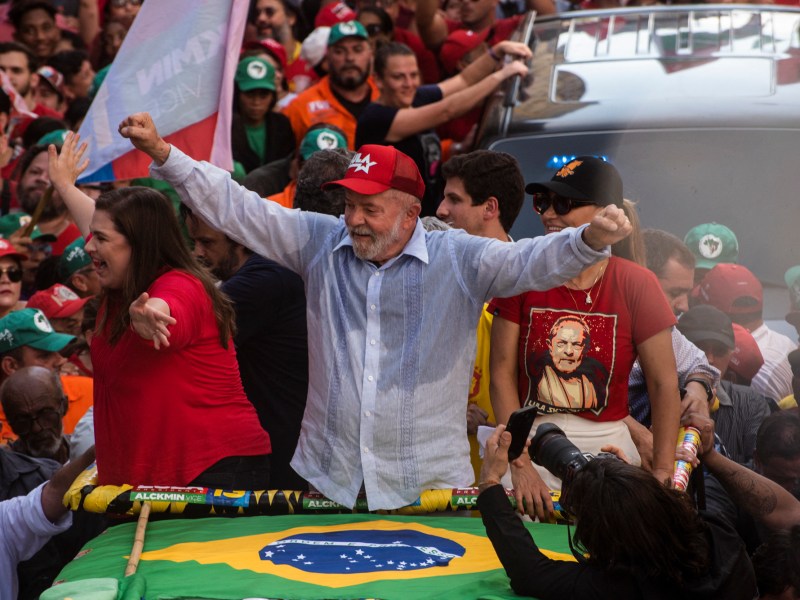 Brazil's former president (2003-2010) and presidential candidate for the leftist Workers Party (PT), Luiz Inacio Lula da Silva (R), greets his supporters next to Pernambuco's Governor candidate Marilia Arraes (L) during a rally in Recife, Pernambuco state, Brazil, on October 14, 2022.