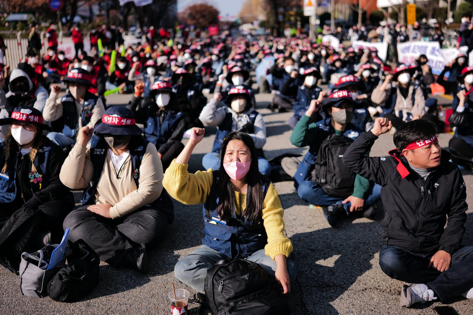 Hundreds of members of the Korean Confederation of Trade Unions' public transport union are shouting slogans during a General Strike of the National Education Office at Yeouido, main finance and investment banking district on November 25, 2022 in Seoul, South Korea. Photo by Chris Jung/NurPhoto via Getty Images