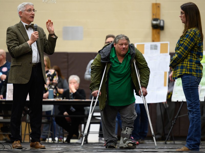 Bruce Vanderhoffin, who is the director of the Ohio Department of Health, answers questions posed by community members at the town hall meeting in East Palestine, OH Photo by Rebecca Kiger for The Washington Post via Getty Images