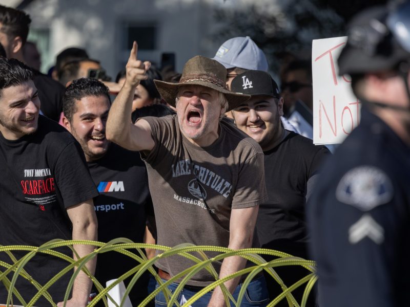 An anti-LGBTQ+ demonstrator yells at pro- demonstrators from behind police barricades outside a Glendale Unified School District (GUSD) Board of Education meeting on June 20, 2023 in Glendale, California. Photo by David McNew/Getty Images
