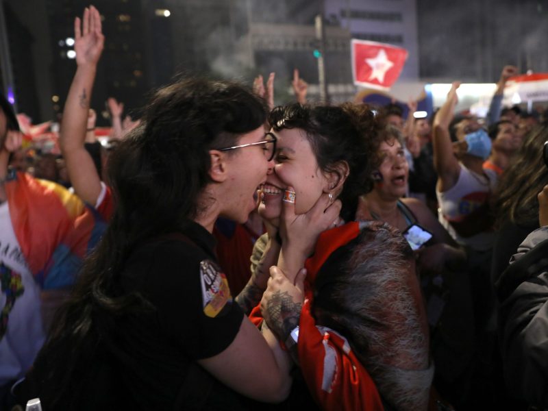 Supporters of former president of Brazil and candidate for the Worker's Party (PT) Luiz Inacio Lula da Silva kiss as waiting for results at the end of the general election day at Paulista avenue on October 2, 2022, in Sao Paulo, Brazil.