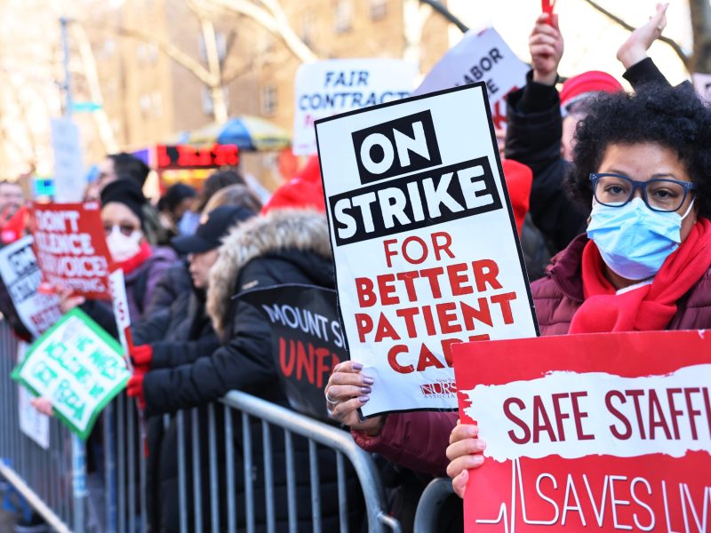 Nurses from Mount Sinai Hospital strike outside the hospital on January 9, 2023, in the Upper East Side neighborhood of New York City.