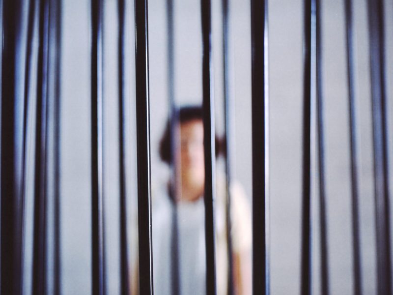 Woman in jail - stock photo