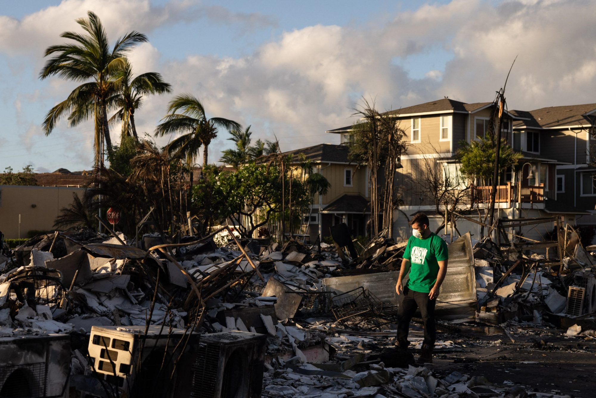 A Mercy Worldwide volunteer makes damage assessment of charred apartment complex in the aftermath of a wildfire in Lahaina, western Maui, Hawaii on August 12, 2023. Photo by YUKI IWAMURA/AFP via Getty Images