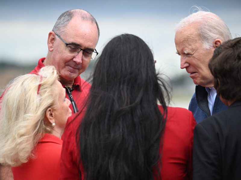 US President Joe Biden (R) is welcomed by United Auto Workers (UAW) President, Shawn Fain (2nd L) and US Representative Debbie Dingell (L) on arrival at Detroit Metropolitan Wayne County Airport in Romulus, Michigan, on September 26, 2023. Photo by JIM WATSON/AFP via Getty Images