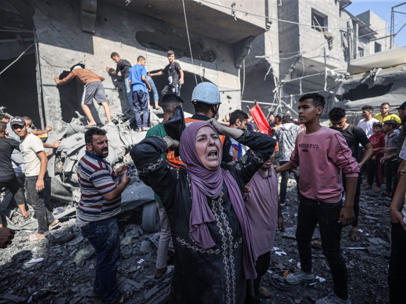 Civil defense teams and residents launch a search and rescue operation around the buildings that were destroyed after Israel's attacks on the Gaza Strip on its eleventh day in Khan Yunis, Gaza on October 17, 2023. Photo by Mustafa Hassona/Anadolu via Getty Images