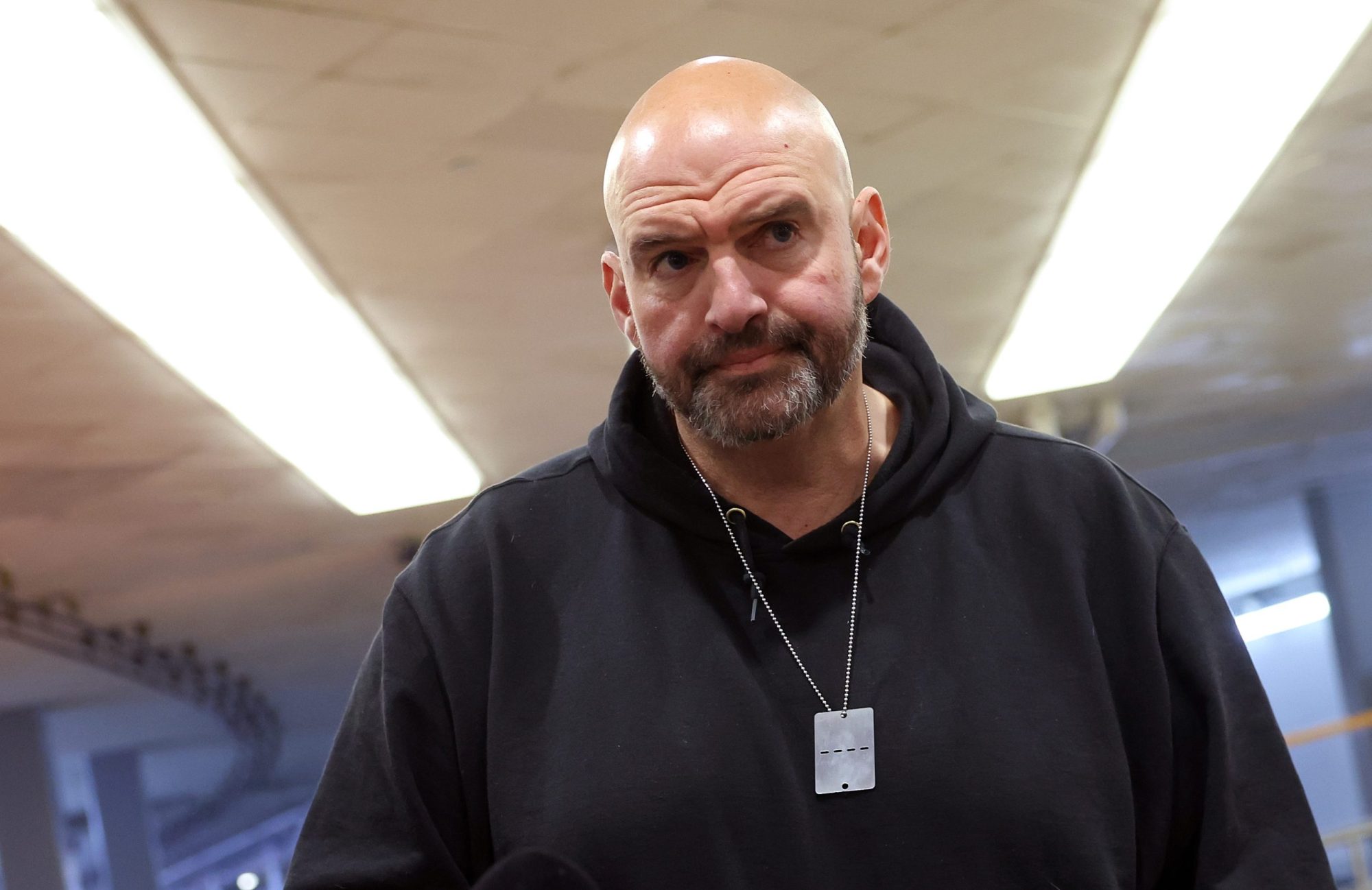 Sen. John Fetterman (D-PA) speaks to reporters before a Senate luncheon at the US Capitol on Dec. 12, 2023, in Washington, DC.