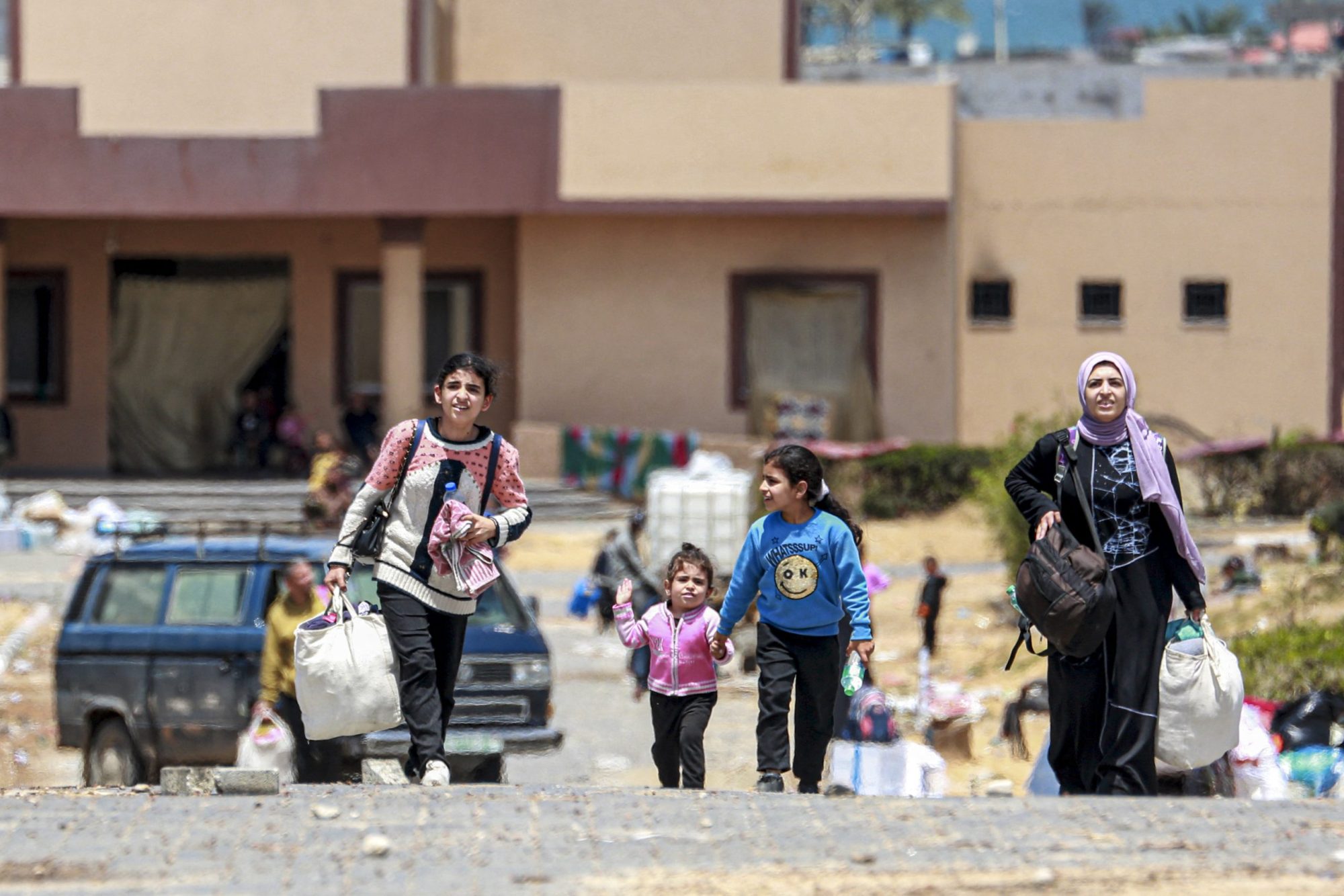 Displaced Palestinians who left with their belongings from Rafah in the southern Gaza Strip following an evacuation order by the Israeli army, arrive to Khan Yunis on May 6, 2024. Photo by -/AFP via Getty Images
