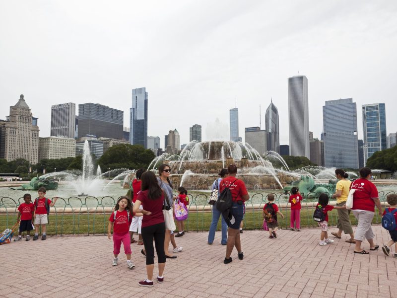 A group of preschool children with their teachers walking by Buckingham Fountain in Grant Park in downtown Chicago in July 2010.