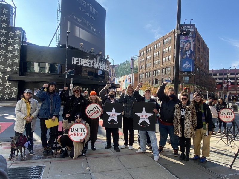 First Avenue workers pose with their fists raised outside the iconic Minneapolis music venue only a few hours before the First Avenue management voluntarily recognized the union. Photo: Isabela Escalona