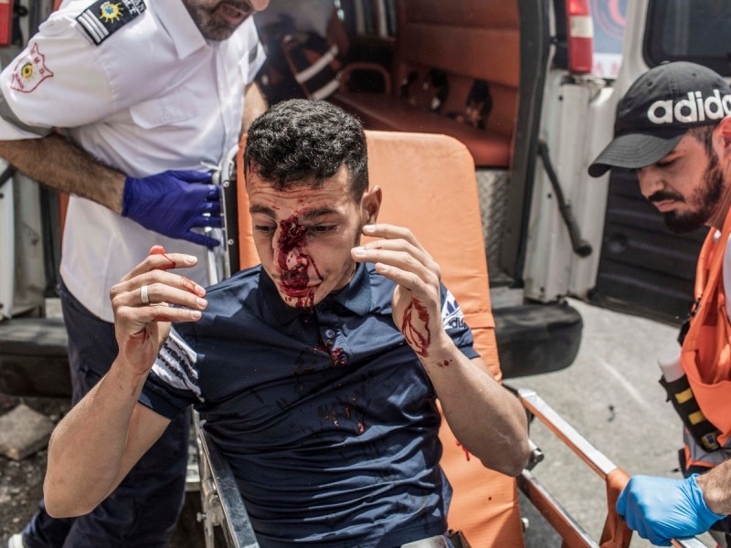 Palestine paramedics transport an injured protester