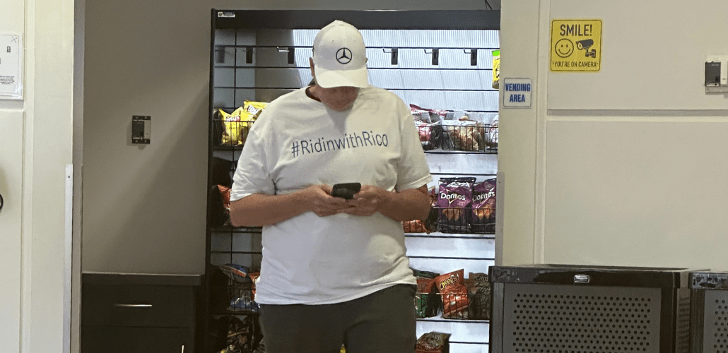 A manager wearing a T-shirt supporting the new CEO waited in the plant cafeteria for results from the vote count. The company's winning move was to fire its U.S. CEO and replace him with a vice president who promised to care about the “team members.” Photo: Luis Feliz Leon